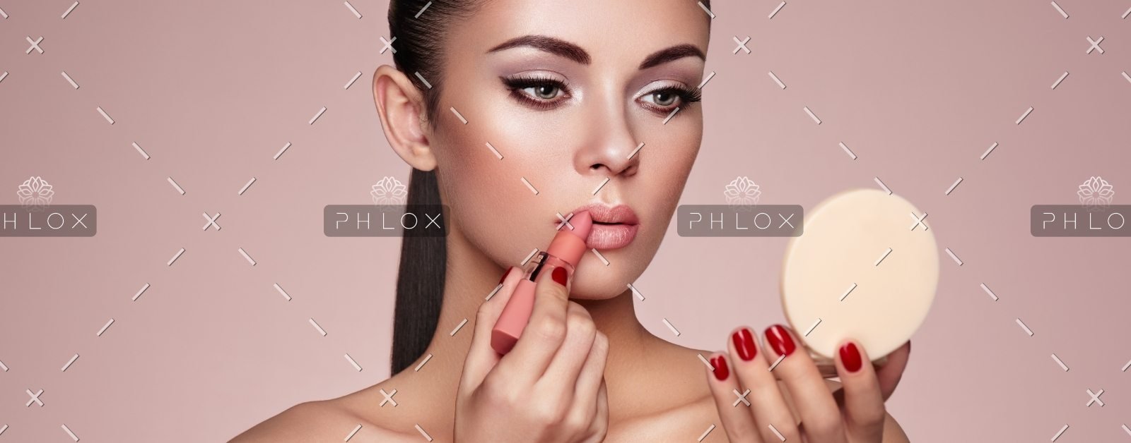 demo-attachment-551-beautiful-woman-paints-lips-with-lipstick-PMB6YWP-1